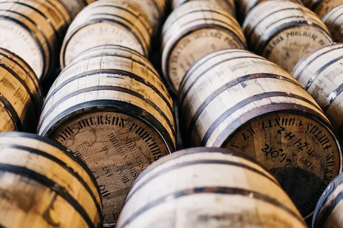 Rows of bourbon barrels in a rickhouse