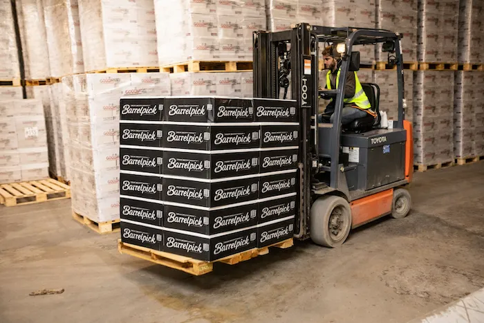 Bourbon being poured from a custom bottle into a glass.